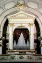 Close up of a well decorated and luxurious pipe organ in a church