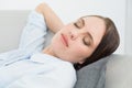 Close up of a well dressed beautiful woman sleeping on sofa Royalty Free Stock Photo