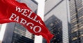 Close-up of Wells Fargo bank flag waving in a financial district