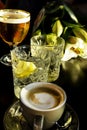 Close up of a wet glass cold beer, martini with lemon slices, cup of coffee Selective focus Royalty Free Stock Photo