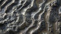 Abstract Mudflat Texture with Wave Patterns in Coastal Shoreline Environment Royalty Free Stock Photo