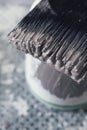 Close up of wet paint on brush bristles overhead vertical Royalty Free Stock Photo