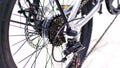 Close up wheel and chain of mountain biking. Landscape view of disc break system and front Derailleur of moutain bike.