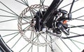 Close up wheel and chain of mountain biking. Landscape view of disc break system and front Derailleur of moutain bike.