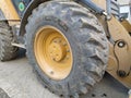 Close-up of a wheel from a grader. Construction, land and road works. Excavator tire. Sremska Mitrovica, Serbia, October 18, 2020 Royalty Free Stock Photo