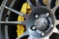 Close-up of a wheel of a Porshe car OZ Ultraleggera Rim with eight-piston brake system