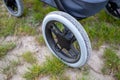 Close-up of a wheel from a stroller in a meadow Royalty Free Stock Photo