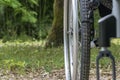 Close-up on the wheel of a wheelchair, from the front, in the middle of nature Royalty Free Stock Photo