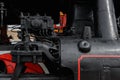 Close-up of wheels on an antique steam train waiting to leave the station Royalty Free Stock Photo