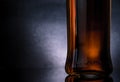 Close-up of whiskey bottle on black background, cool atmosphere