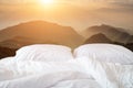 Close up white bedding sheets and pillow on view of mountain Royalty Free Stock Photo