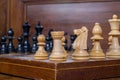 Close up white and black chess figurines on a chess board Royalty Free Stock Photo