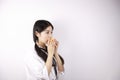 Close up white blank background Asian Chinese girl young woman is eating fruit orange healthy balanced life Royalty Free Stock Photo