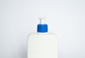 Close up white blank plastic bottle with dispenser pump for gel, liquid soap, lotion, cream, shampoo on white background Royalty Free Stock Photo