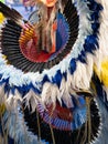 Close Up of White and Blue Headdress and Bustle Worn by a Fancy Dancer
