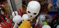 Close up of white bold scull head in female hand exposed for sale in a shop before jewish pur