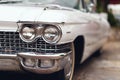 Close-up of a White 1960 Cadillac\'s Headlight