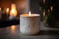 close-up of white candle with crackling flame, casting warm and inviting light