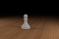 White, glass, chess pawn on a hard wood surface Royalty Free Stock Photo