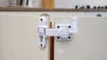 Child safety cabinet lock on kitchen doors â AI content Royalty Free Stock Photo