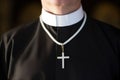 close-up of white clerical collar on black priest robe