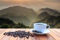 Close up white coffee cup and coffee beans on wood table and vie Royalty Free Stock Photo