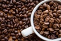 Close up of white coffee cup full of coffee beans background Royalty Free Stock Photo