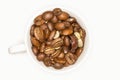 Close Up Of A White Coffee Cup Full Of Coffee Beans Royalty Free Stock Photo