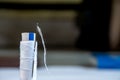 Close-up of a white color thread spool of sewing machine and a needle, vertically placed Royalty Free Stock Photo