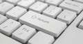 Close-up of a White Computer Keyboard with Focus on the Return Key technology input Royalty Free Stock Photo