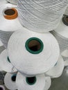 Close up of white cotton yarn bobbin in textile industry