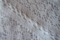 Close-up of white crochet lace fabric Royalty Free Stock Photo