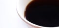 Close up white cup of hot black coffee with copy space and selective focus Royalty Free Stock Photo