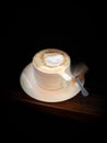 Close up white cup hot coffee in dark scene Royalty Free Stock Photo