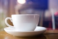 Close up white cup with soft steaming hot coffee on table Royalty Free Stock Photo