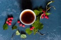 Top view teacup and hawthorn berries Royalty Free Stock Photo