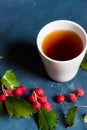 Top view teacup and hawthorn berries Royalty Free Stock Photo