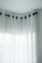 White curtains with ring-top rail