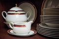 Close up white decorated china teaset and plates