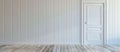 A close up of a white door in a room with a wooden floor Royalty Free Stock Photo