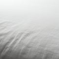 A close-up of a white fabric surface. The material appears textured and slightly creased Royalty Free Stock Photo