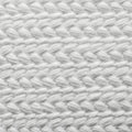 Close-up of a white fabric surface with a pronounced weave texture. The pattern Royalty Free Stock Photo