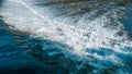 Close up of white, fast flowing, turbulent water flowing over dam on river Royalty Free Stock Photo
