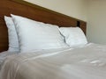 Close up white fluffy pillows on double bed Royalty Free Stock Photo