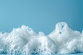 Close-up of white foam against a blue background Royalty Free Stock Photo