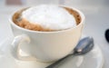 Close-up white frothed milk on cappuccino or latte coffee. Hot coffee  ready-to-drink in the morning Royalty Free Stock Photo