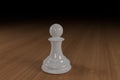 Close up of a white, glass, chess pawn on a wooden surface Royalty Free Stock Photo