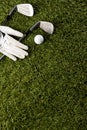 Close up of white glove, golf balls and golf clubs on grass with copy space Royalty Free Stock Photo