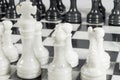 Close-up of white king on chess game opening. Marble board