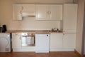Close-up of white kitchen unit in modern interior Royalty Free Stock Photo